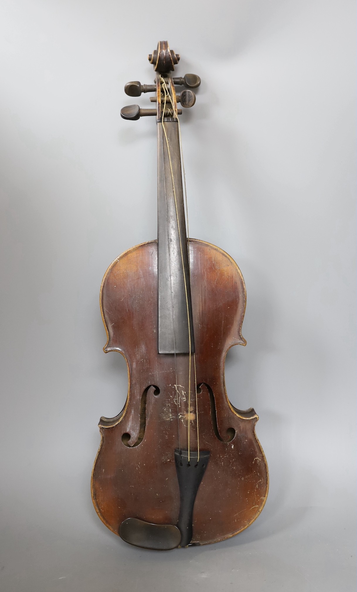A cased German violin, labelled Stradivarius and dated 1886, back measures 36cm excl button